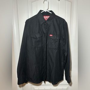 Black Dixxon Flannel long Sleeve “the Outlaw” Flannel shirt.